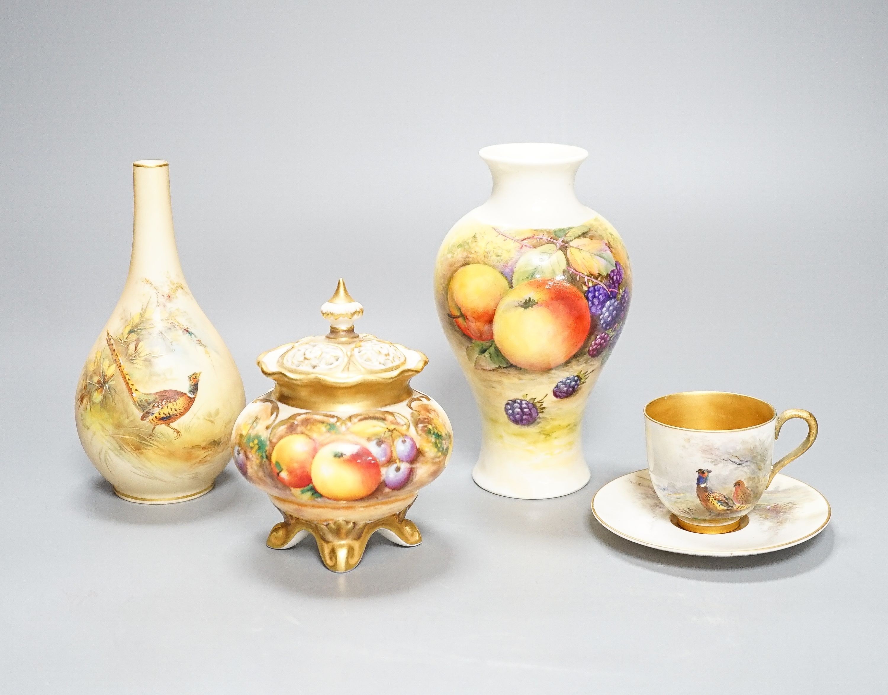 A Royal Worcester fruit painted small pot pourri and cover, 10.9cm high and a similar vase, 15cm, a Royal Worcester miniature cup and saucer, painted with pheasants, signed James Stinton and Grainger & Co pheasant vase